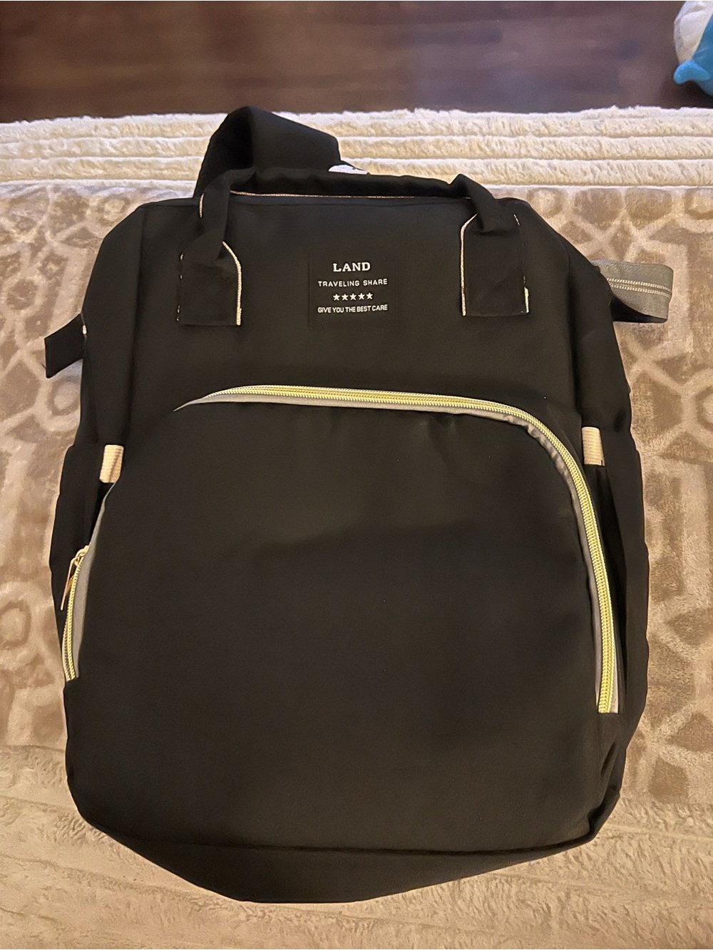 Diaper bag that transform into foldable portable bed